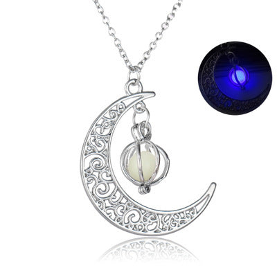 Close-up of round glowing moon locket pendant with silver chain | Oria Jewel