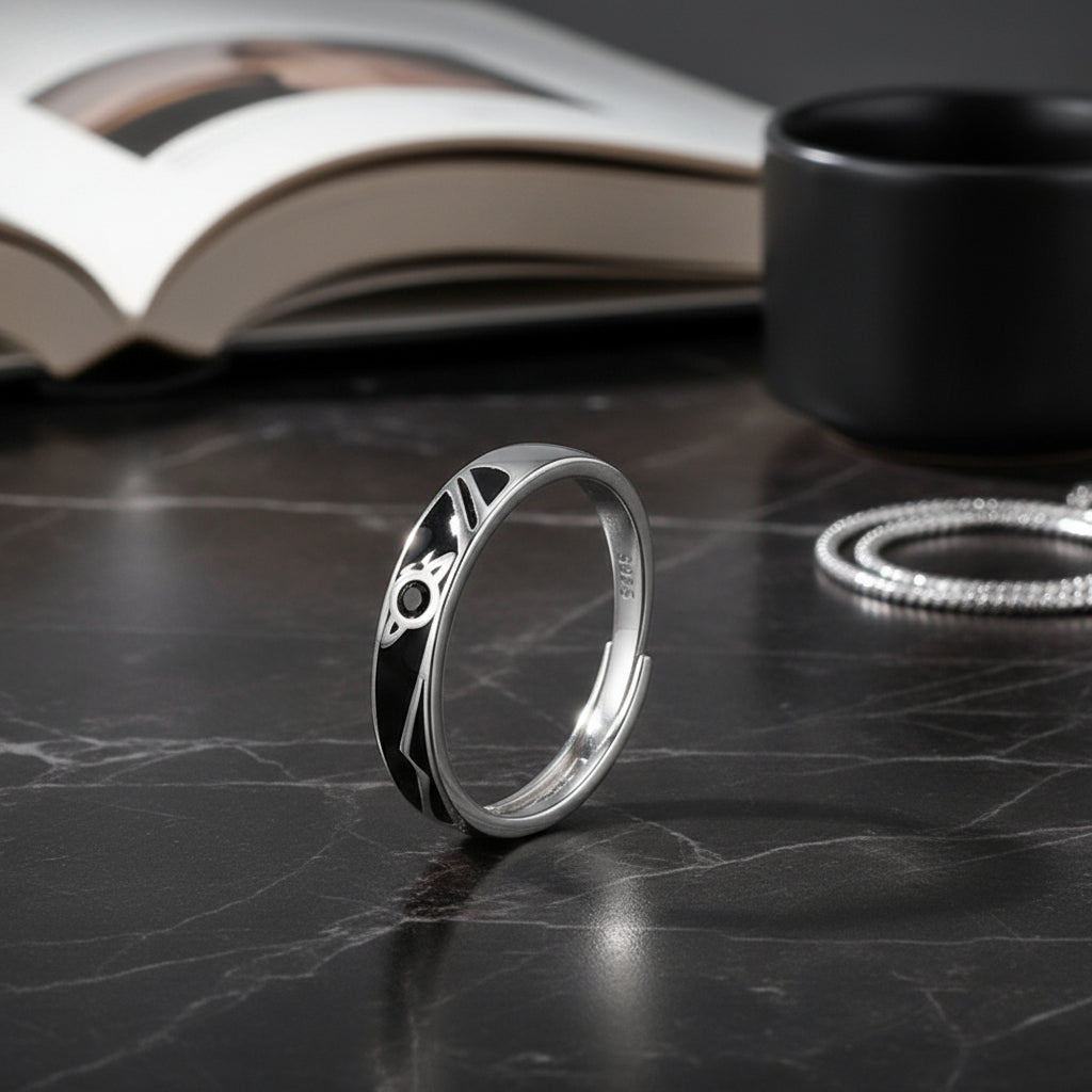 Blue Aurora Twist Ring displayed on a marble surface with an open book and accessories in the background | Oria Jewel