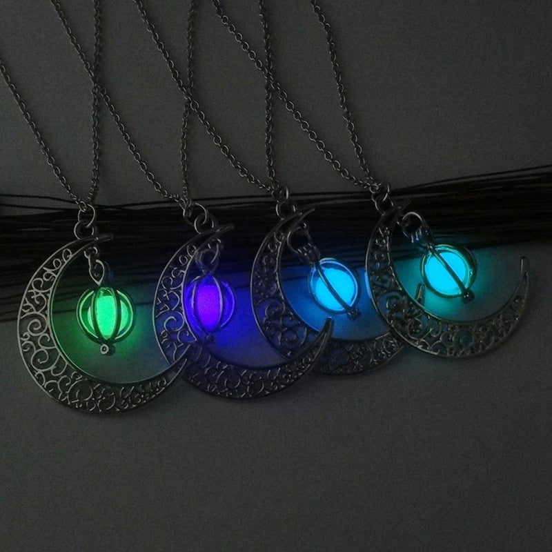 Silver glowing moon locket necklace glowing softly in the dark | Oria Jewel
