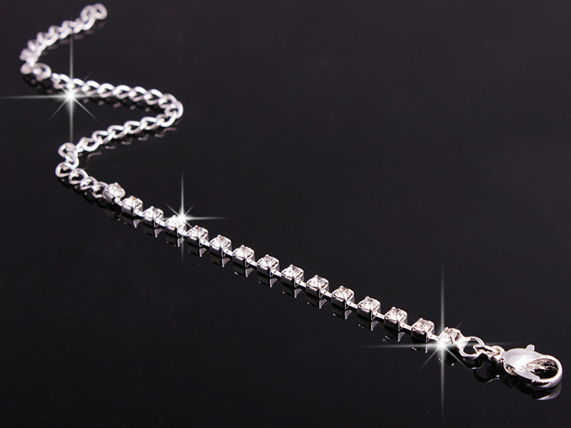Rhinestone Jewelry Set featuring a sparkling bracelet with a silver chain and shimmering rhinestones | Oria Jewel