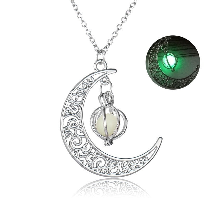 Close-up of round glowing moon locket pendant with silver chain | Oria Jewel