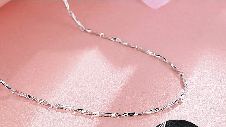 minimalist silver circle chain necklace with soft lighting | Oria Jewel