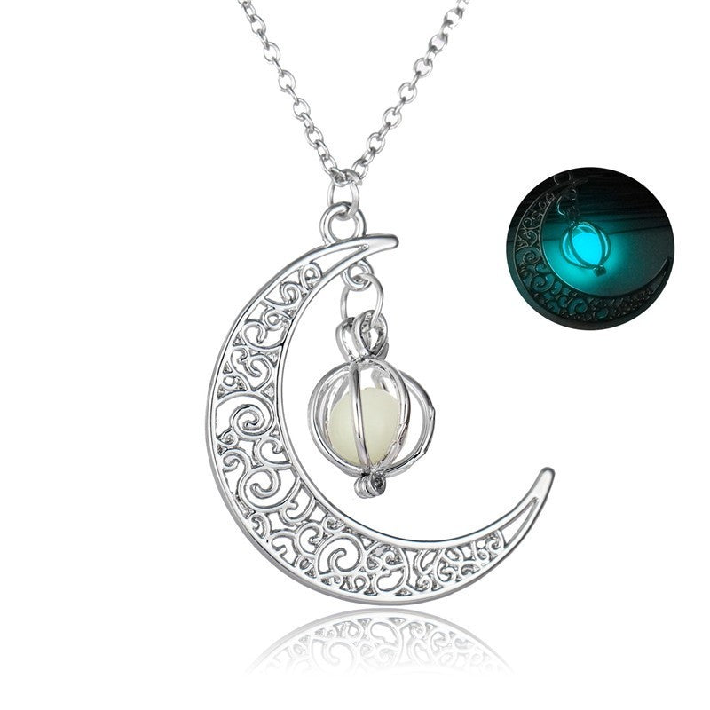 Close-up of round glowing moon locket pendant with silver chain | Oria Jewel