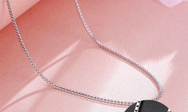 minimalist silver circle chain necklace with soft lighting | Oria Jewel