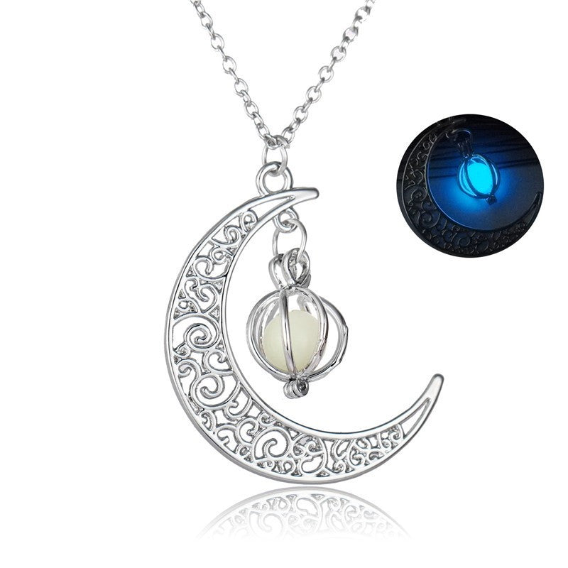 Close-up of round glowing moon locket pendant with silver chain | Oria Jewel