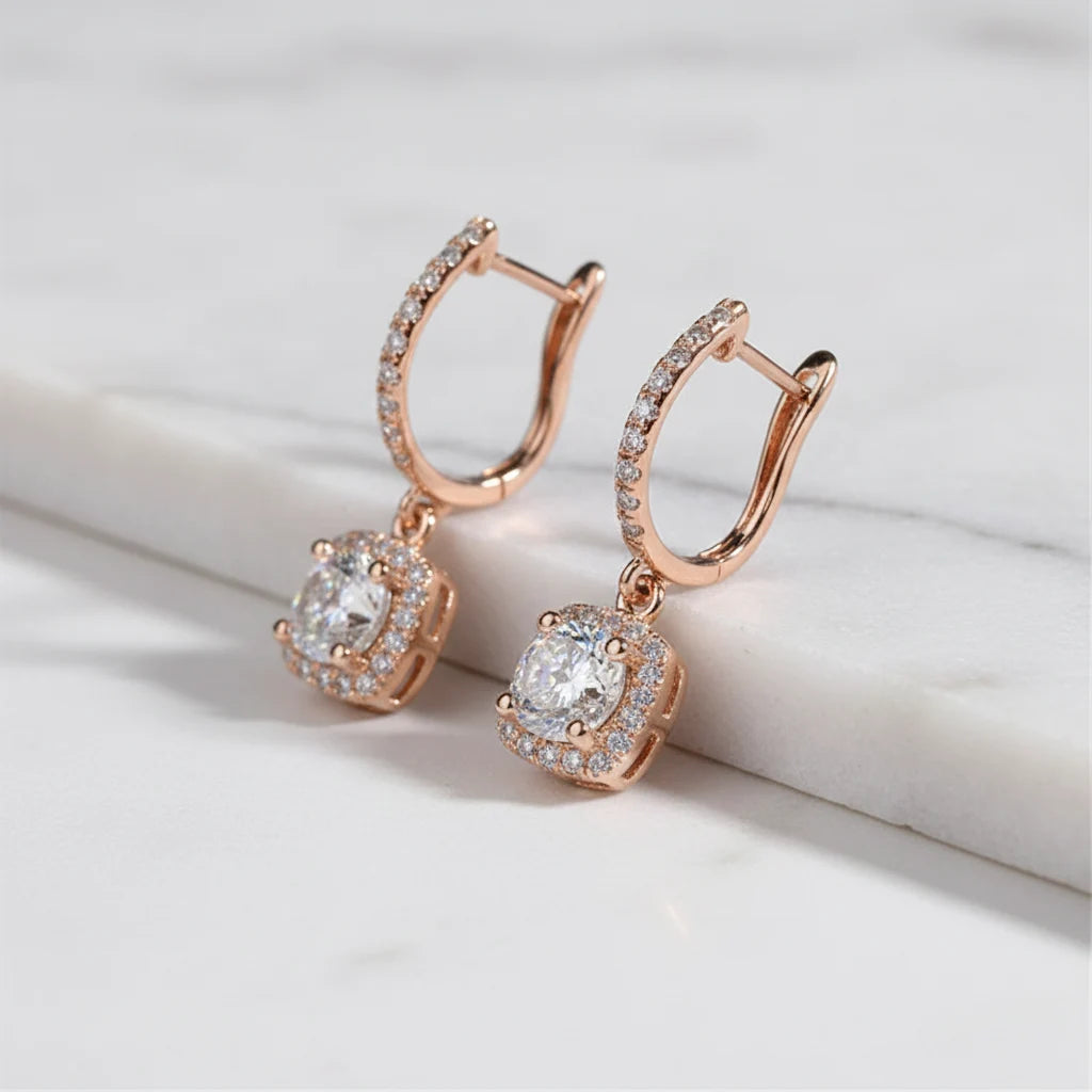 Bronze Crystal Drop Huggie Earrings close-up angled view on white marble ledge | OriaJewel