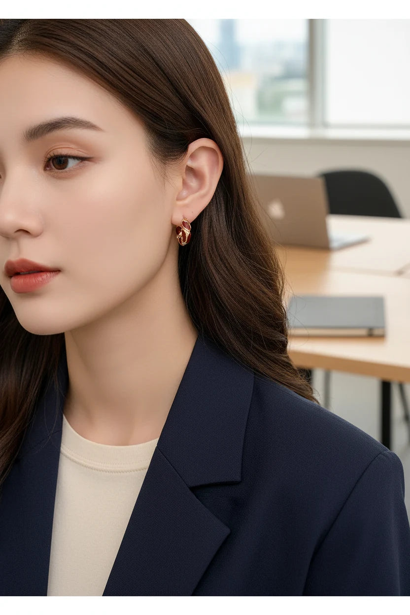 Burgundy Red Huggie Hoop Earrings worn by model close-up in office setting | OriaJewel