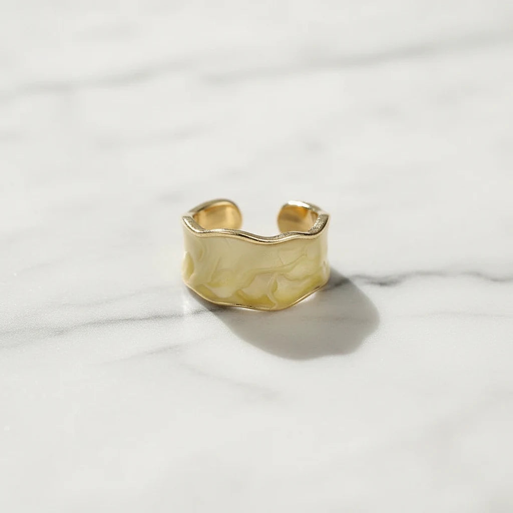 Champagne Marble Open Wave Ring on white marble surface showing the adjustable open band | OriaJewel