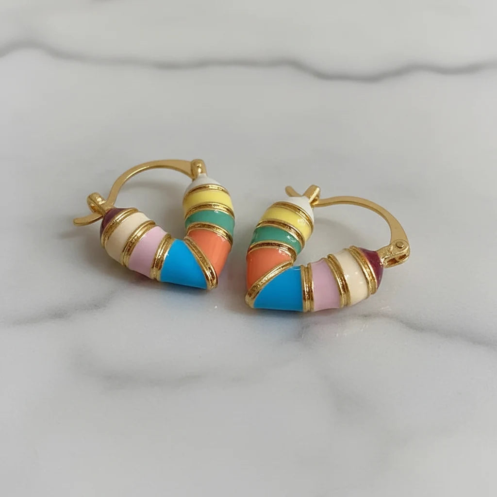 Colorful Heart Huggie Hoop Earrings close-up on marble surface | OriaJewel