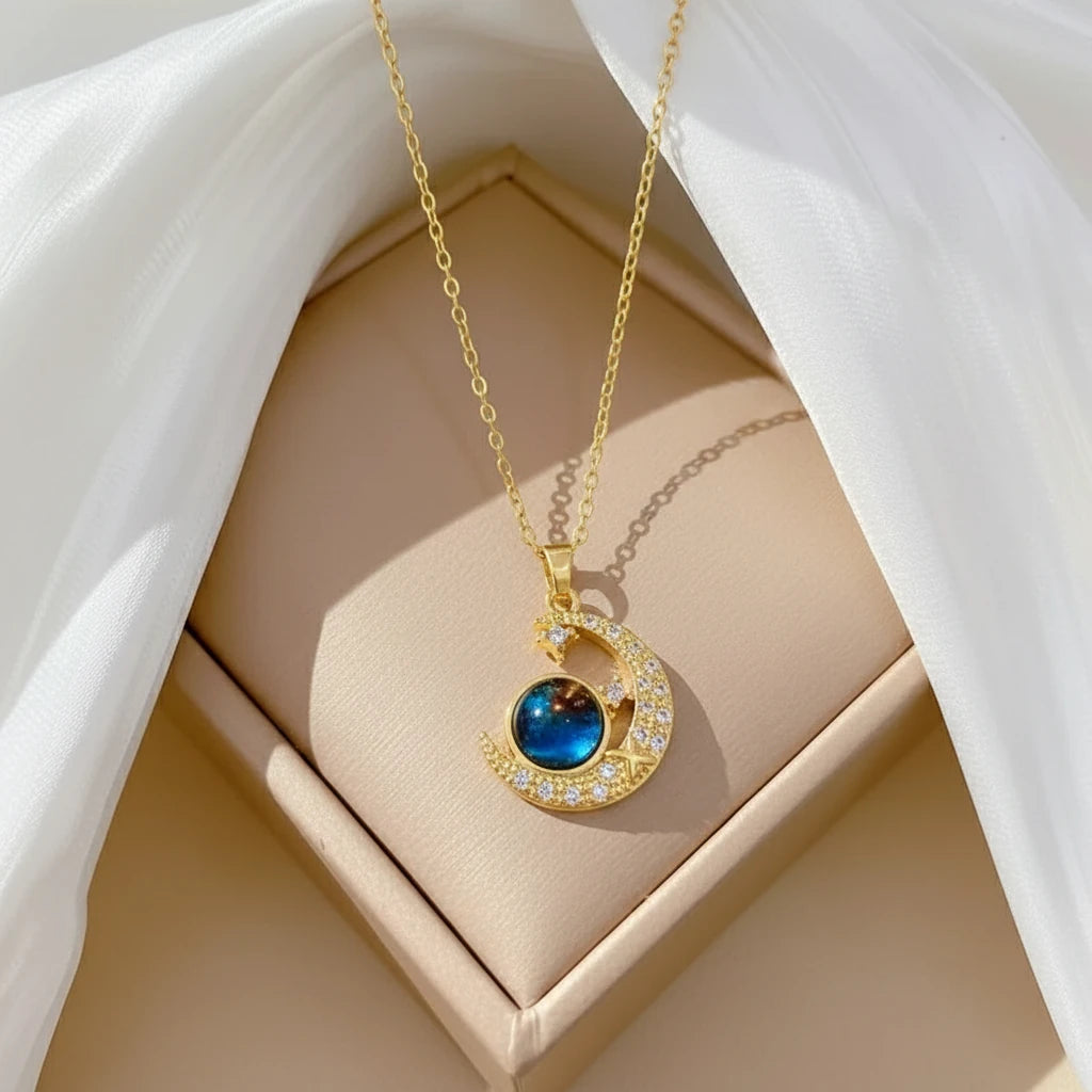 Cute Matching Couples Necklaces featuring a golden crescent moon pendant with a sparkling gemstone | Oria Jewel