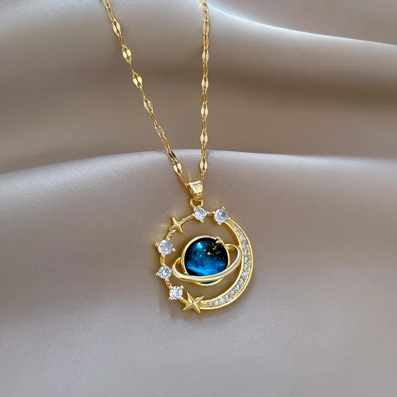 Cute Matching Couples Necklaces featuring a gold moon and stars pendant with a blue gemstone | Oria Jewel