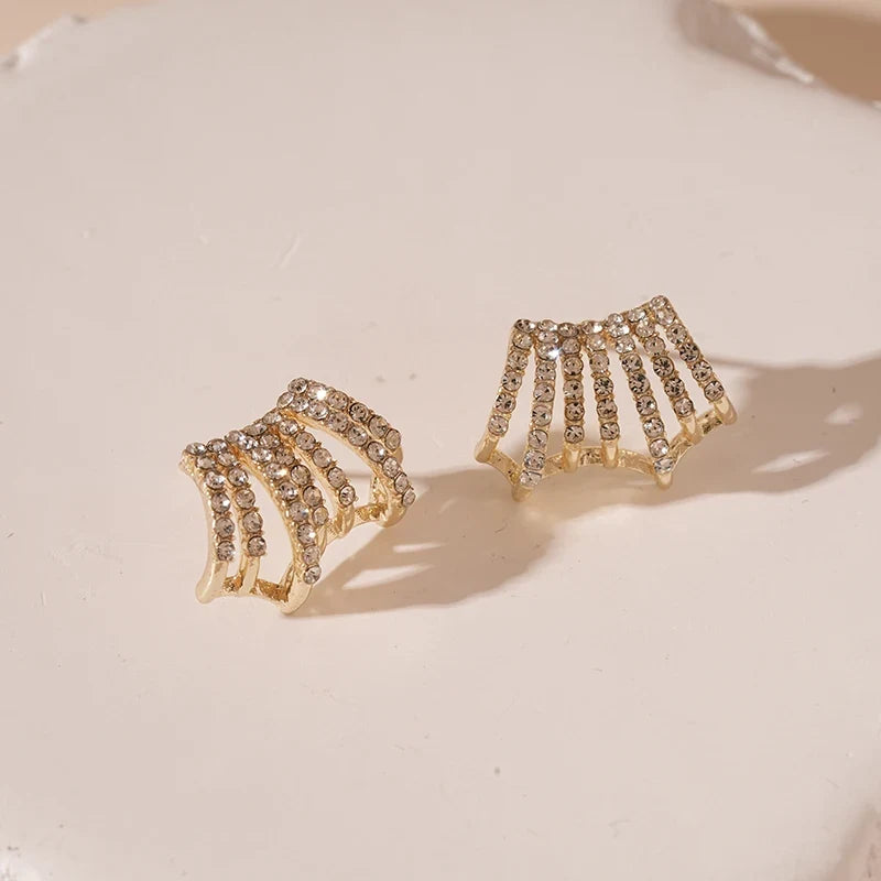 Fan Ear Cuff Earrings product close-up on soft neutral surface | OriaJewel