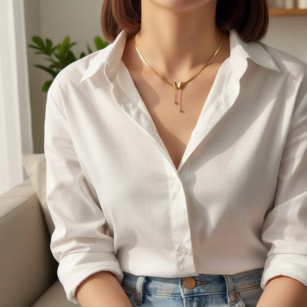 Gold Butterfly Chain Necklace paired with white shirt and jeans for elegant everyday style | Oria Jewel