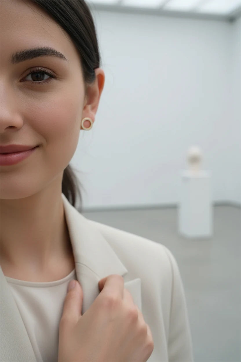 Gold Circle Stud Earrings worn on model in gallery portrait close-up | OriaJewel