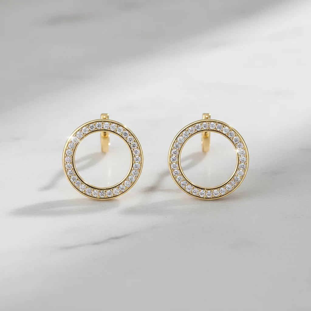 Gold Circle Stud Earrings close-up on marble background | OriaJewel