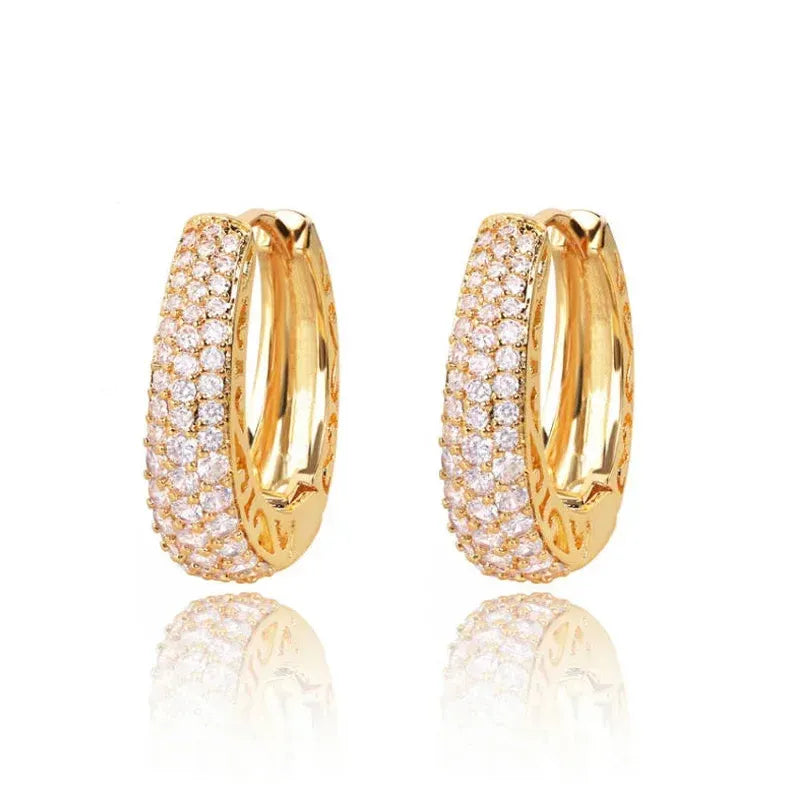 Gold Pavé Huggie Hoop Earrings isolated on white background | OriaJewel