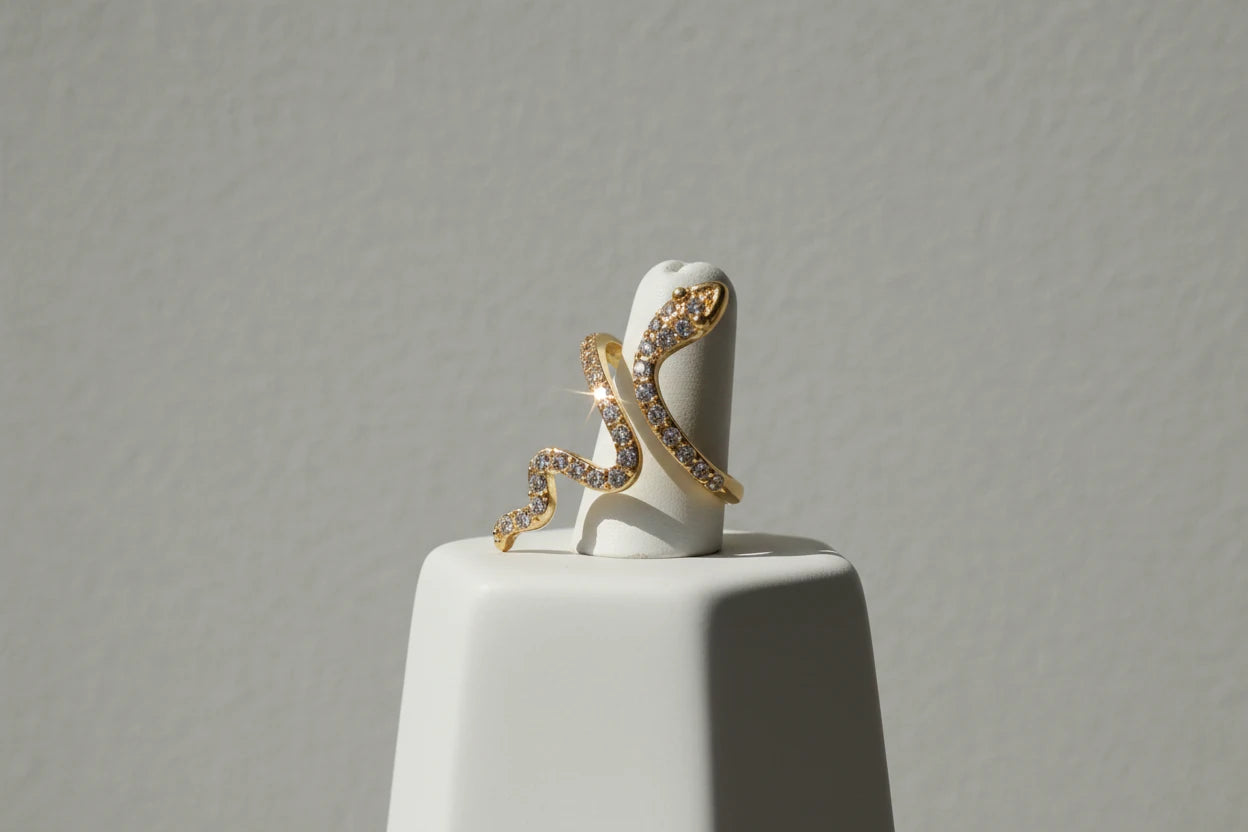 gold Pavé snake wrap ring on a white ring stand with a clean studio background | OriaJewel
