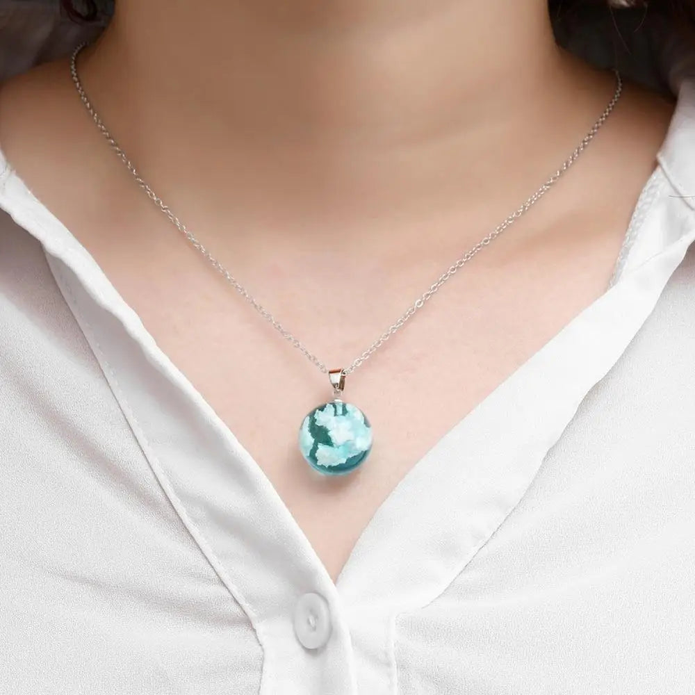 Model wearing cloud resin necklace with soft lighting | Oria Jewel