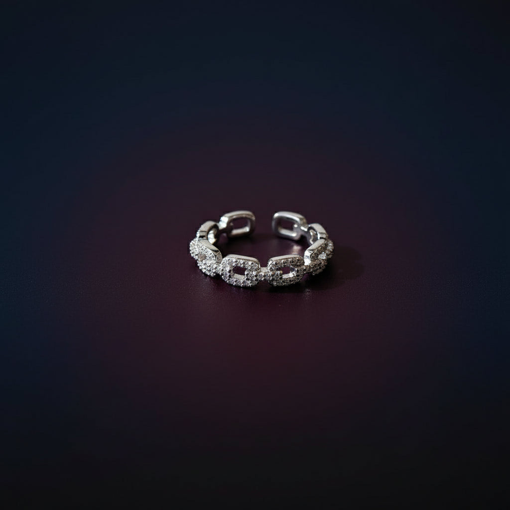 Adjustable silver Crystal Link Chain Ring shimmering on a dark surface | Oria Jewel