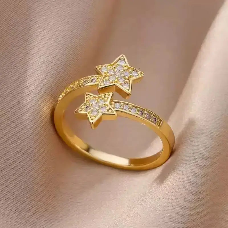Pavé Double Star Open Ring close-up on soft beige fabric, adjustable open design with two sparkling pavé star ends and pavé stones along the band | OriaJewel