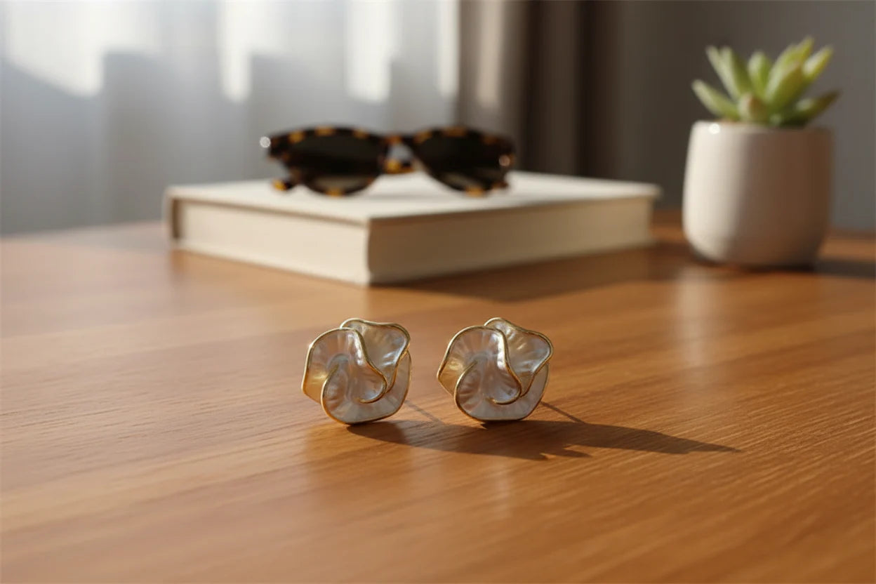 Pearl Rosette Stud Earrings on wooden desk with book and sunglasses | OriaJewel