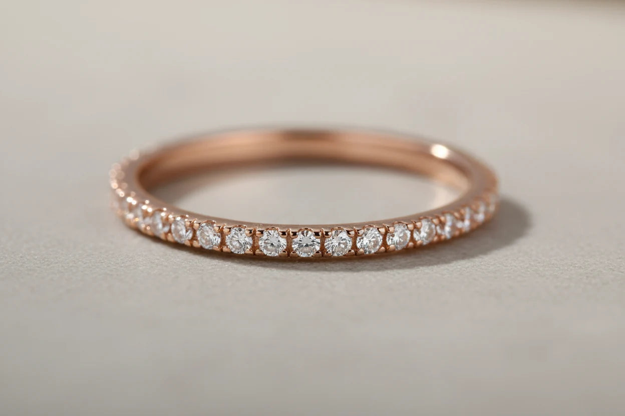 Rose Midi Ring Set macro close-up of rose-gold pavé band with round clear stones on a neutral gray background | OriaJewel