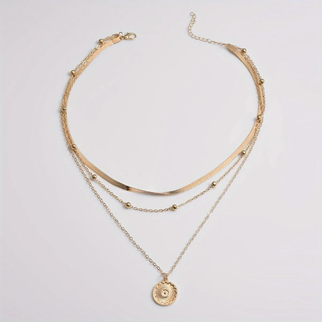 Adjustable multi-layer silver circle chain necklace shining under soft light | Oria Jewel