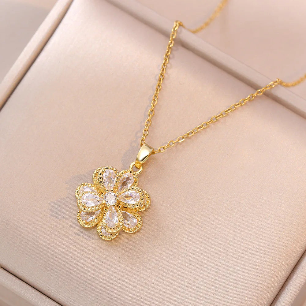 Elegant gold pendant rose flower necklace on soft beige background | Oria Jewel