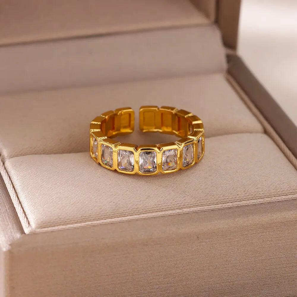 Gilded Glow Crystal Ring with sparkling crystals set in a gold band, displayed elegantly on a jewelry box | Oria Jewel