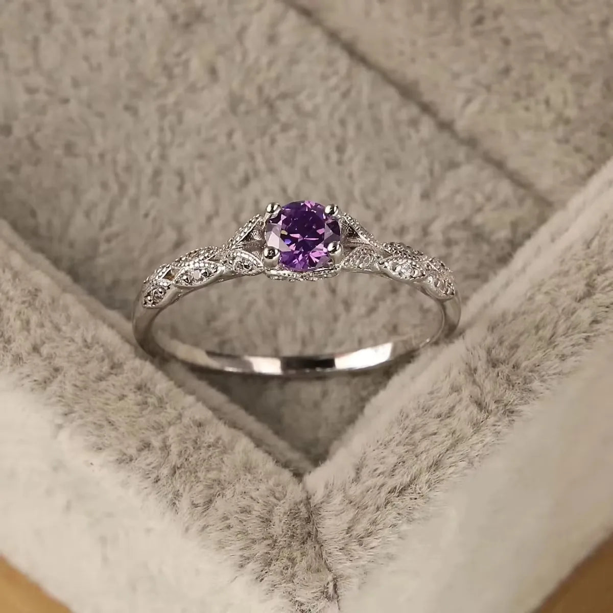 Violet Whisper Gemstone Ring with filigree silver band, glistening on grey velvet | Oria Jewel