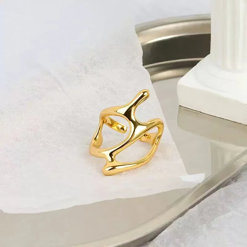 Abstract, polished gold Sculpted Metal Statement Ring on white and silver tray | Oria Jewel