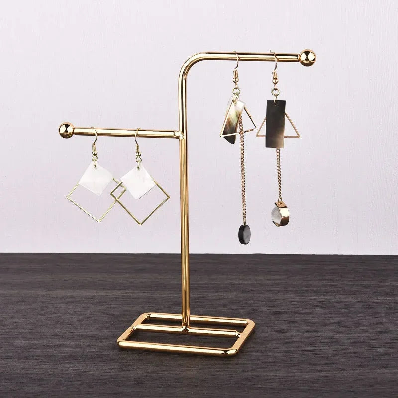 Gold Metal earring holder stand close-up with earrings displayed | Oria Jewel