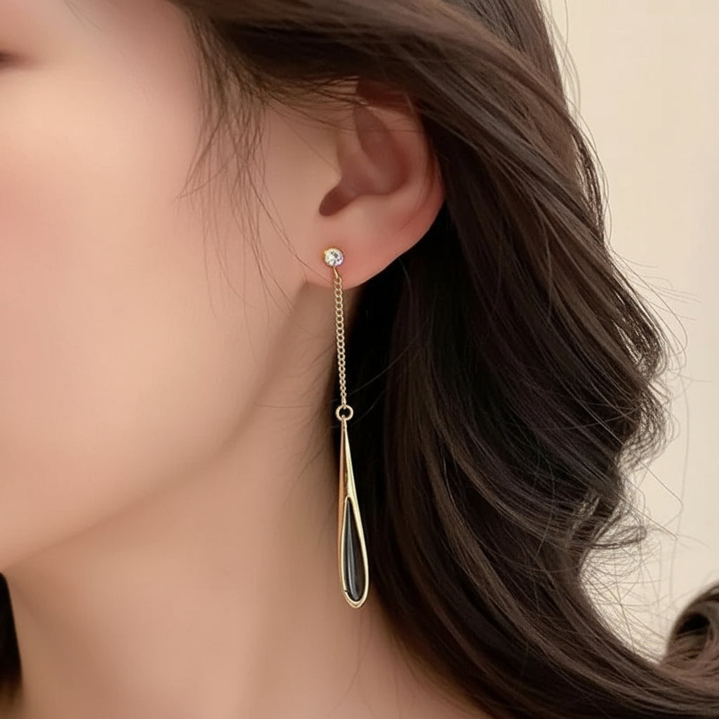 Teardrop Chain Earrings hanging elegantly on a model&