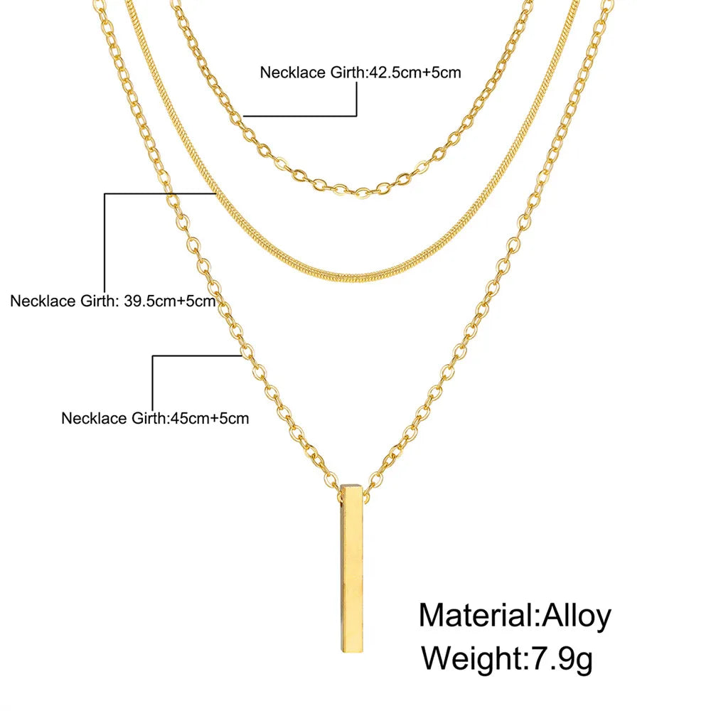 Drop Bar Pendant Necklace in gold with triple layered chains, showing necklace girth sizes 39.5cm, 42.5cm, and 45cm plus 5cm extension; made of alloy, weight 7.9g | Oria Jewel