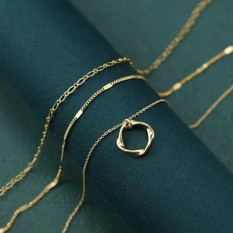 Elegant multi layered gold chain necklace with polished shine and delicate layers | Oria Jewel