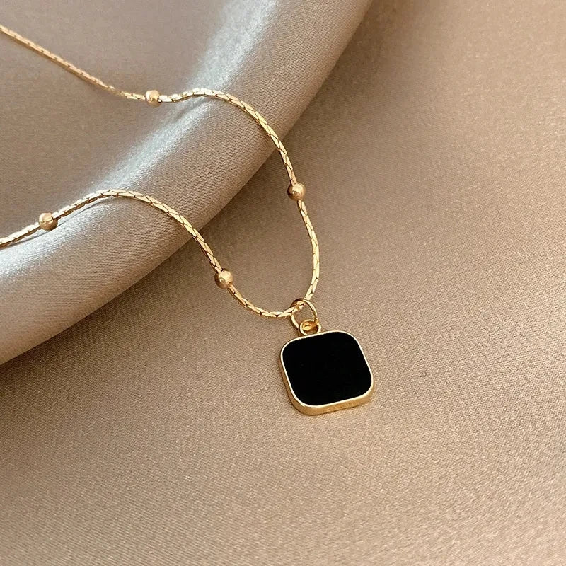 Minimalist Square Pendant Choker jewelry flat lay with free pouch gift | Oria Jewel