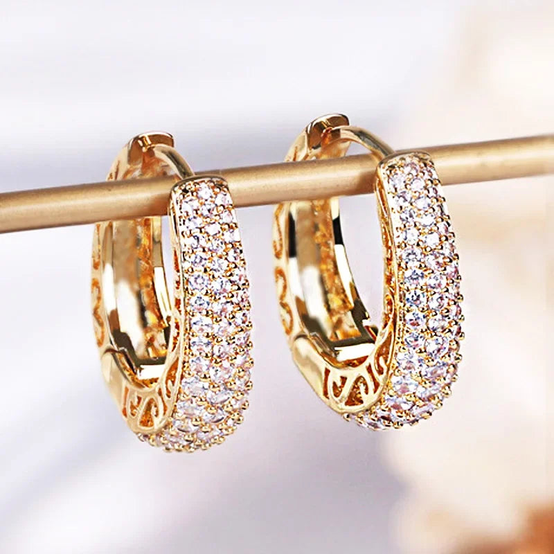Detailed Crystal Gold Huggie Earrings with pavé crystals and filigree hang brightly | Oria Jewel