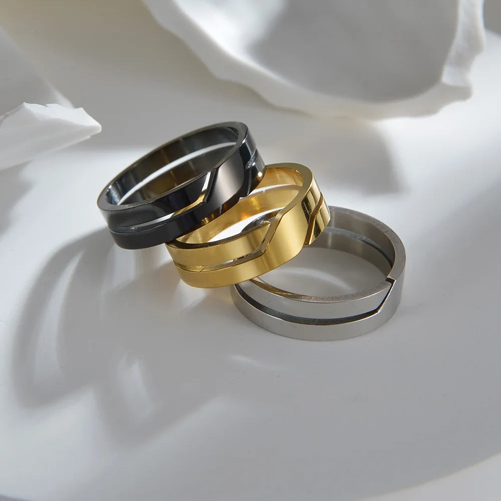 Shiny black, Geometric Gold Band Ring, and silver rings on bright white | Oria Jewel