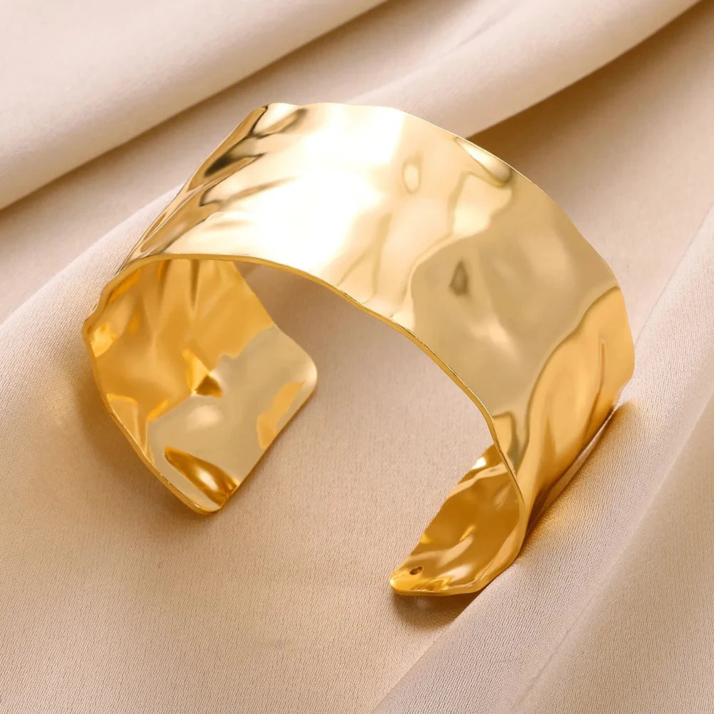 adjustable Gold steel wrist cuffs on wrist close-up