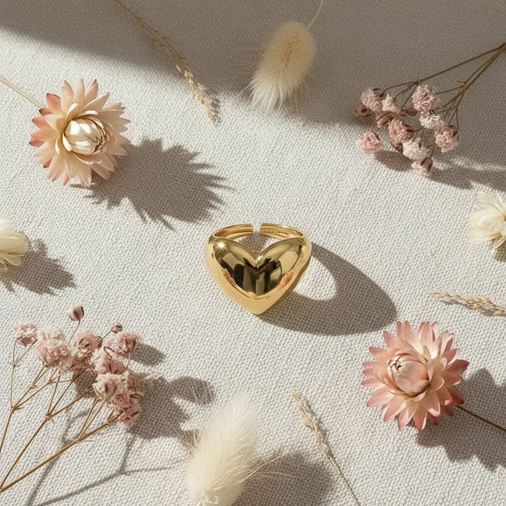 Modern Love Heart Ring surrounded by dried flowers on a textured fabric background | Oria Jewel