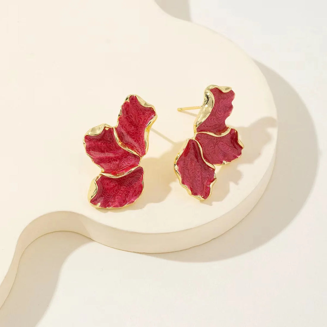 Vibrant red enamel petal stud earrings; complement creamy daisy hoops collection | Oria Jewel