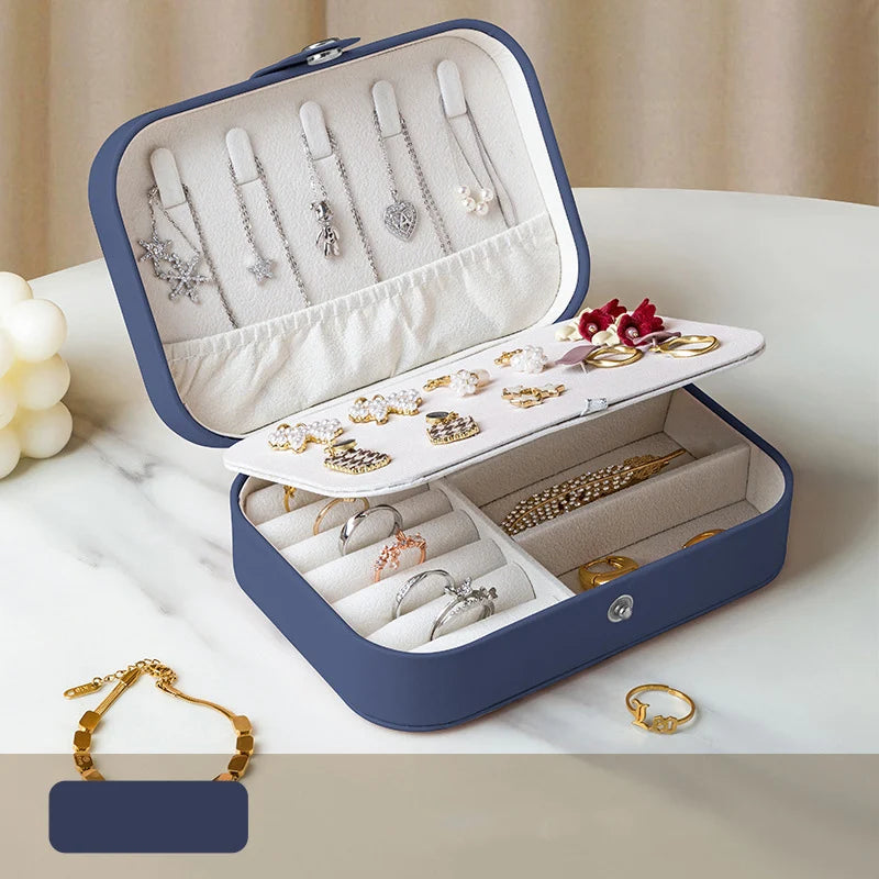 Compact portable jewelry storage box holding silver rings, earrings, and bracelets | Oria Jewel