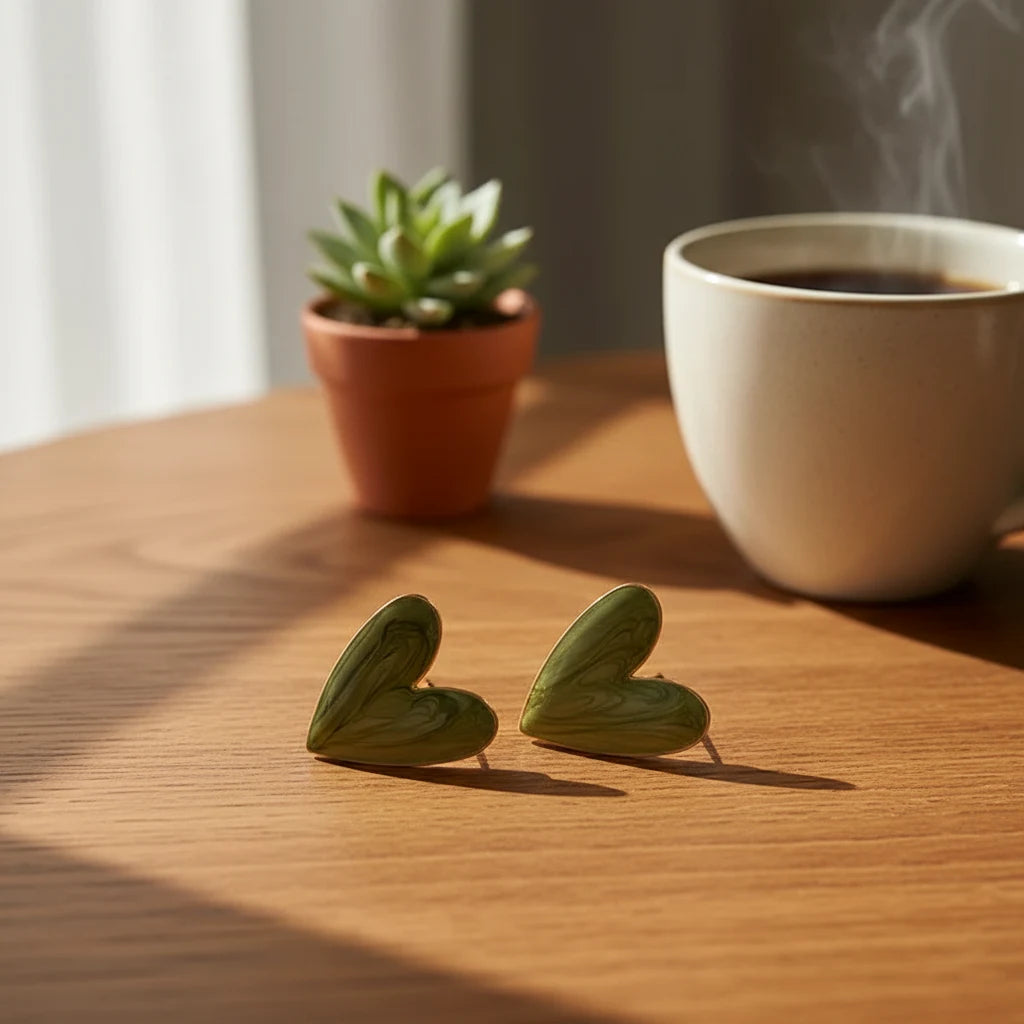 Sage Green Marble Heart Stud Earrings on wooden table with coffee and plant | OriaJewel