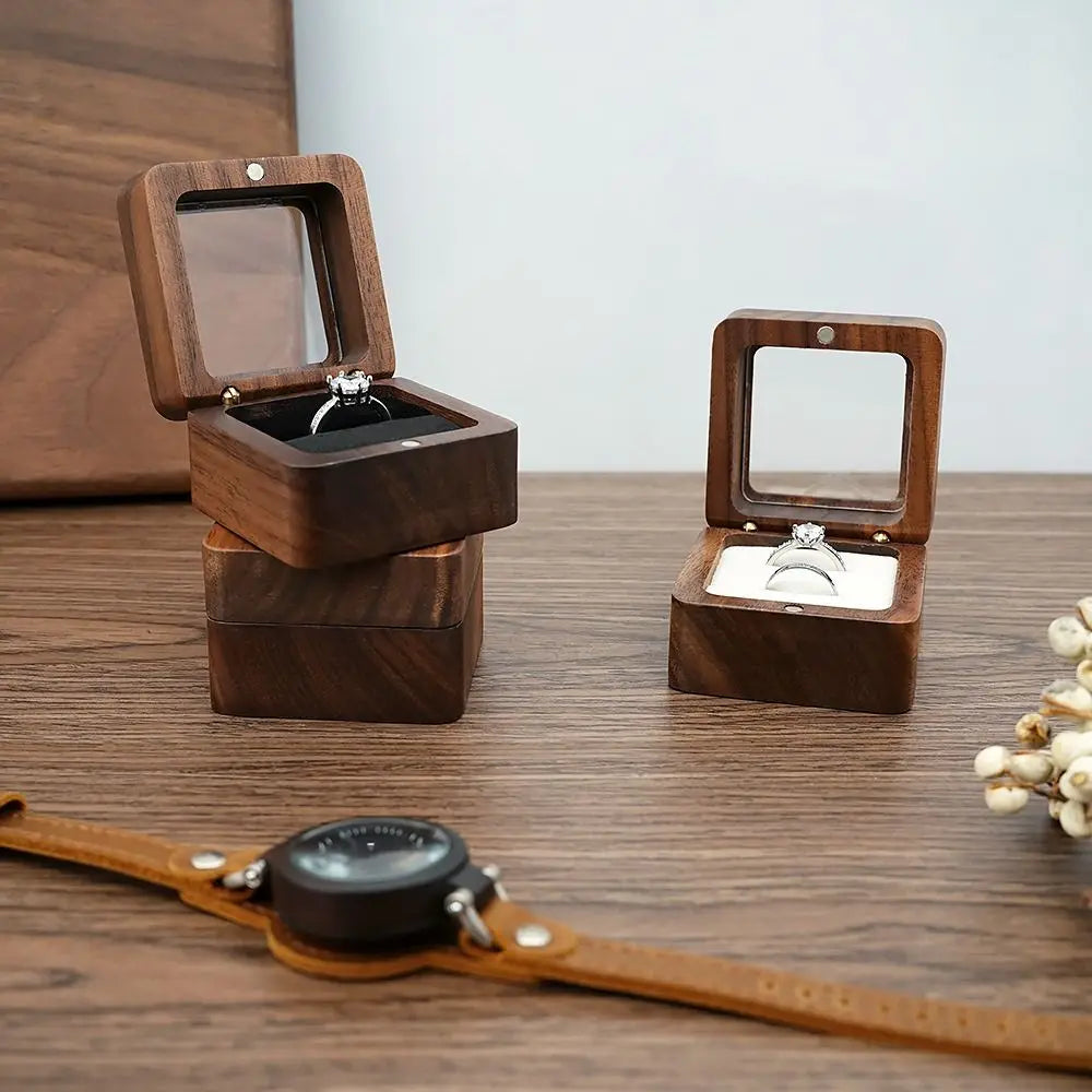 wooden wedding ring box holding rings | Oria Jewel