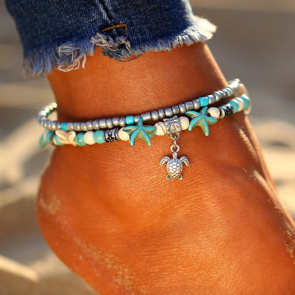 woman wearing Stylish Starfish Anklet at the beach with barefoot style | Oria Jewel
