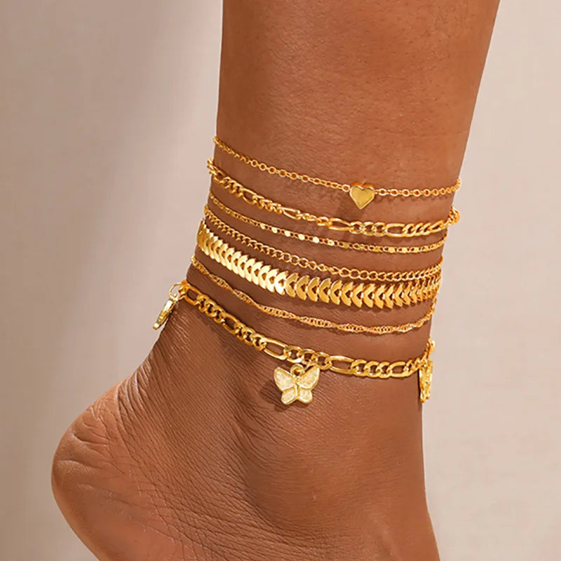 Close-up of layered Bohemian Starfish Anklet Set with starfish charms on ankle | Oria Jewel