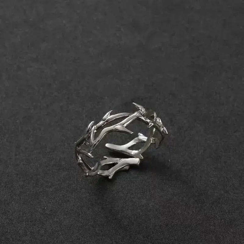 Silver Antler Wrap Ring set arranged on a matte black background with spiky branch-shaped silver pieces, showcasing the rugged wrap aesthetic and sharp accents | OriaJewel