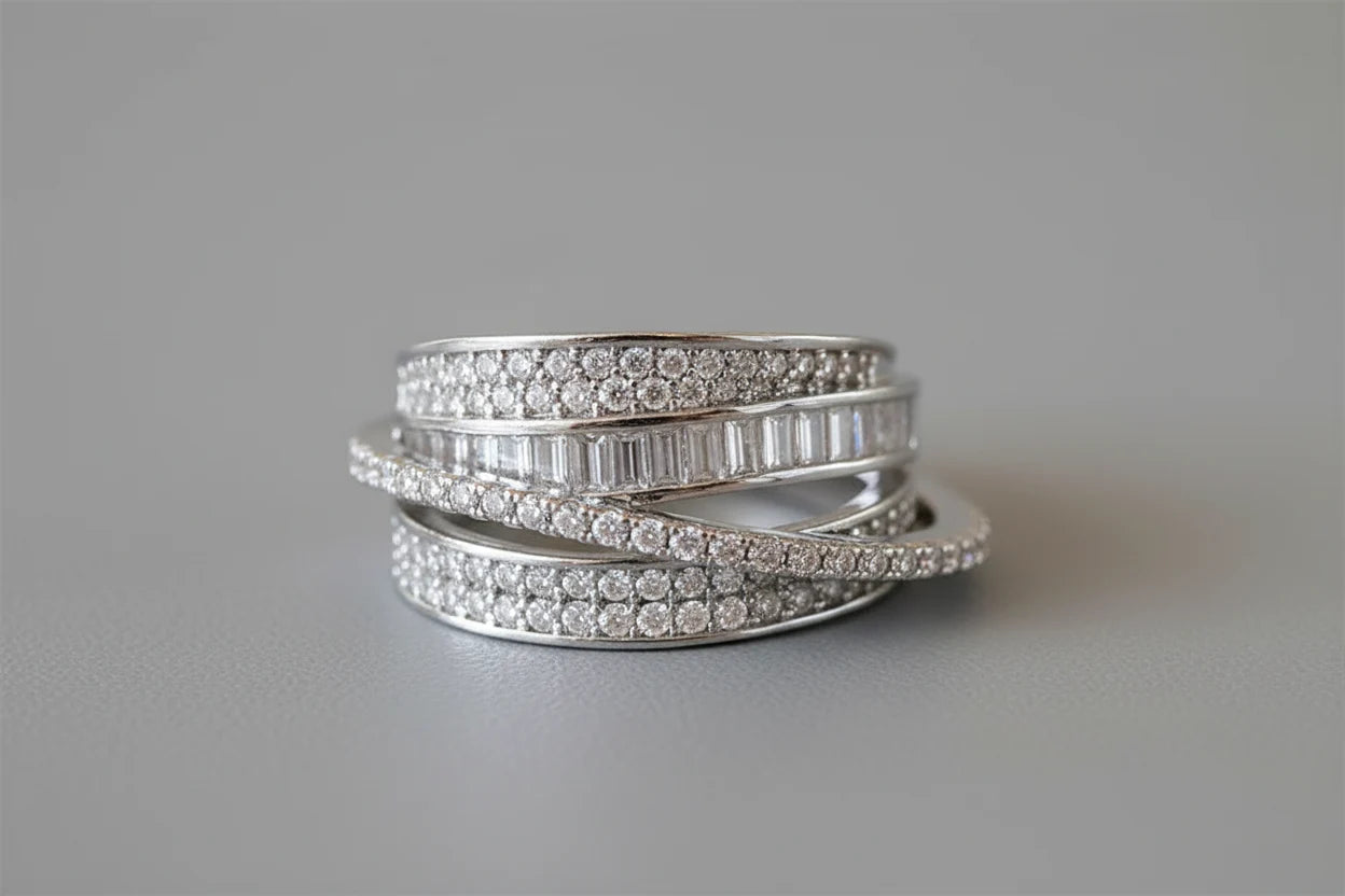 Silver CZ Wrap Ring macro shot on a neutral gray background, crisp detail on the wrap-around bands, pavé CZ setting, and sleek polished silver tone | OriaJewel