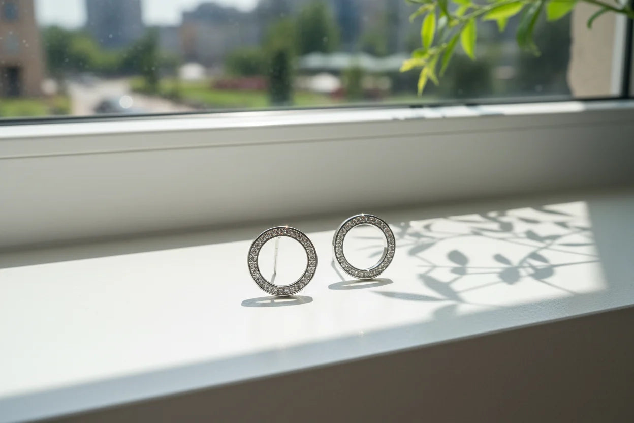 Silver Circle Stud Earrings on windowsill with soft natural light | OriaJewel