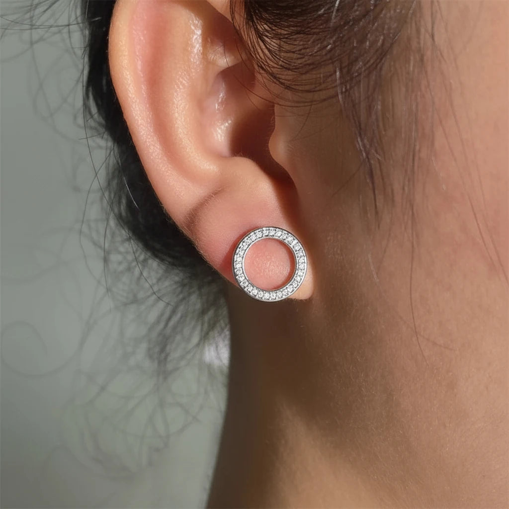 Silver Circle Stud Earrings worn close-up on ear | OriaJewel